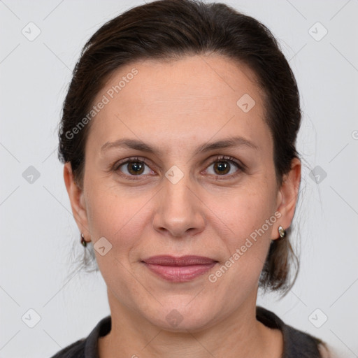 Joyful white adult female with medium  brown hair and brown eyes