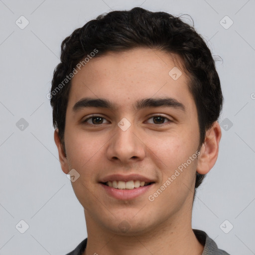 Joyful white young-adult male with short  black hair and brown eyes