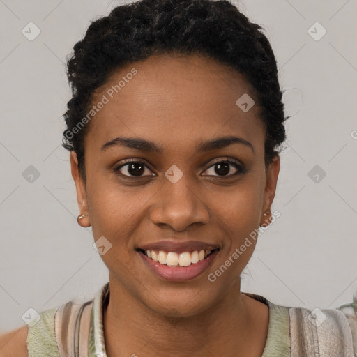 Joyful black young-adult female with short  black hair and brown eyes