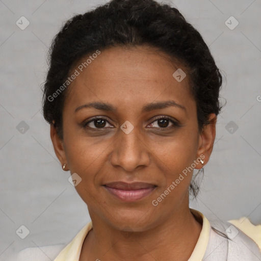 Joyful black adult female with short  brown hair and brown eyes