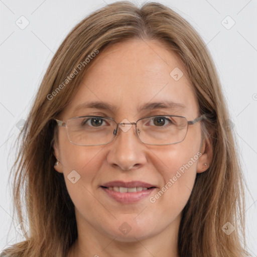 Joyful white adult female with long  brown hair and brown eyes