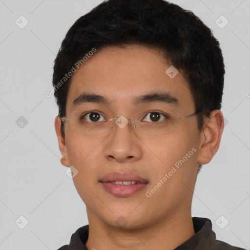 Joyful asian young-adult male with short  brown hair and brown eyes