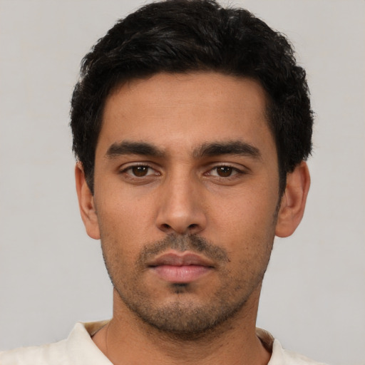 Neutral latino young-adult male with short  black hair and brown eyes