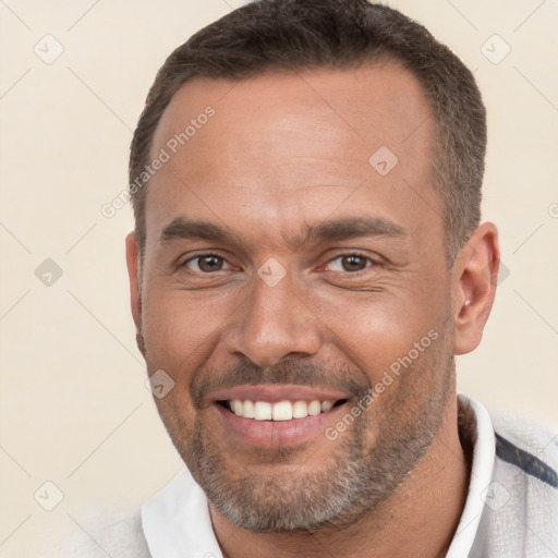 Joyful white adult male with short  brown hair and brown eyes