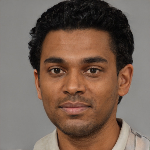 Neutral black young-adult male with short  black hair and brown eyes