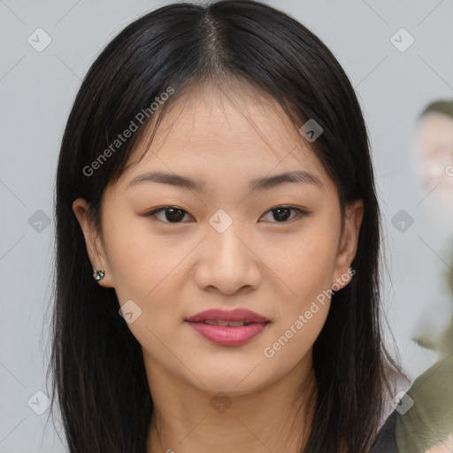 Joyful asian young-adult female with long  brown hair and brown eyes