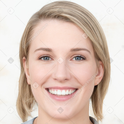 Joyful white young-adult female with medium  brown hair and blue eyes