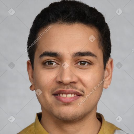 Joyful latino young-adult male with short  black hair and brown eyes