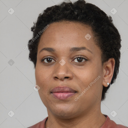 Joyful black young-adult female with short  brown hair and brown eyes