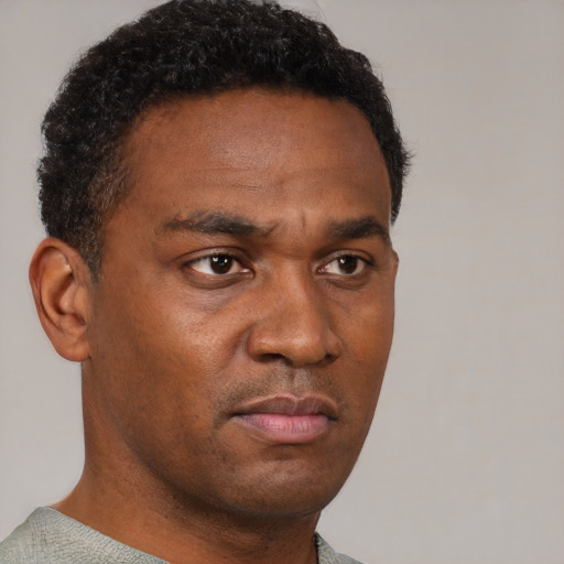 Neutral black young-adult male with short  brown hair and brown eyes