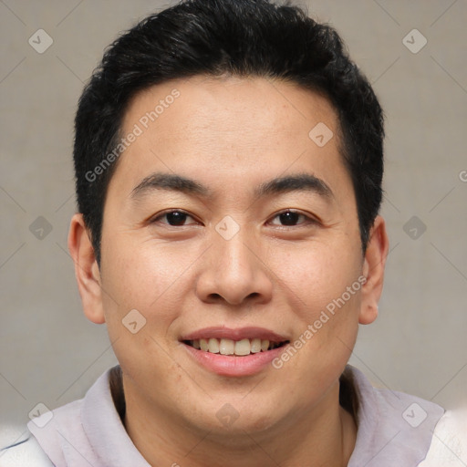 Joyful latino young-adult male with short  brown hair and brown eyes