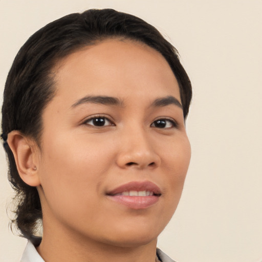 Joyful latino young-adult female with short  brown hair and brown eyes