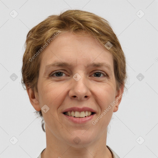 Joyful white adult female with medium  brown hair and grey eyes