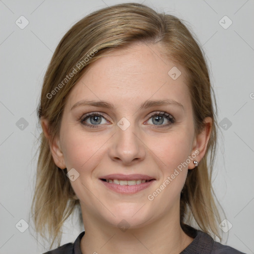 Joyful white young-adult female with medium  brown hair and blue eyes