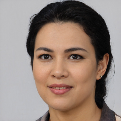 Joyful asian young-adult female with medium  black hair and brown eyes