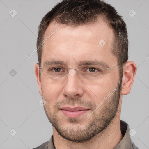 Joyful white adult male with short  brown hair and brown eyes