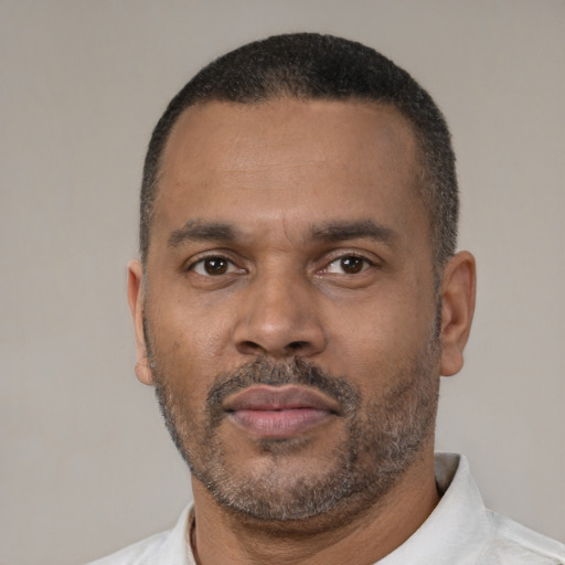 Neutral latino adult male with short  black hair and brown eyes