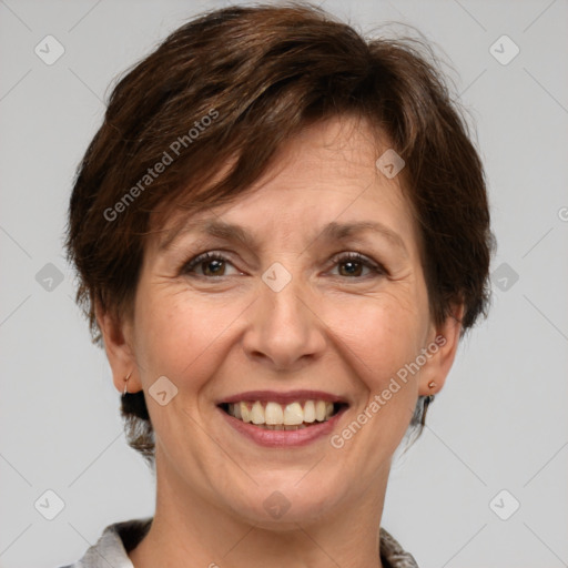 Joyful white adult female with short  brown hair and grey eyes