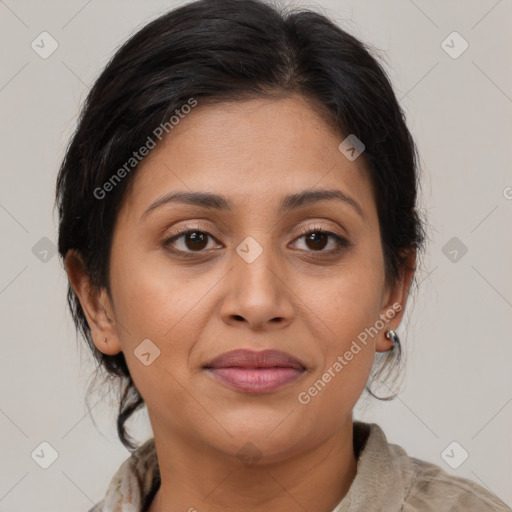 Joyful latino adult female with medium  brown hair and brown eyes