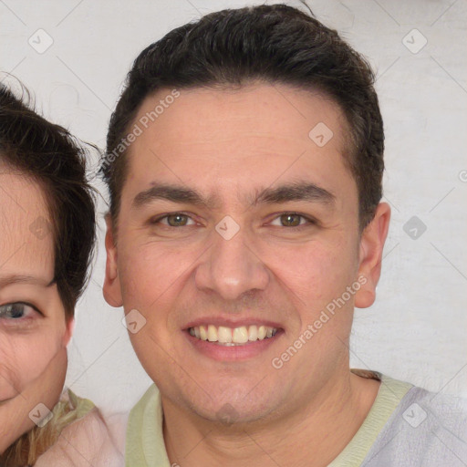 Joyful white young-adult male with short  brown hair and brown eyes