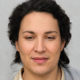 Joyful white adult female with short  brown hair and brown eyes