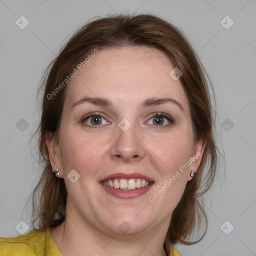 Joyful white young-adult female with medium  brown hair and blue eyes