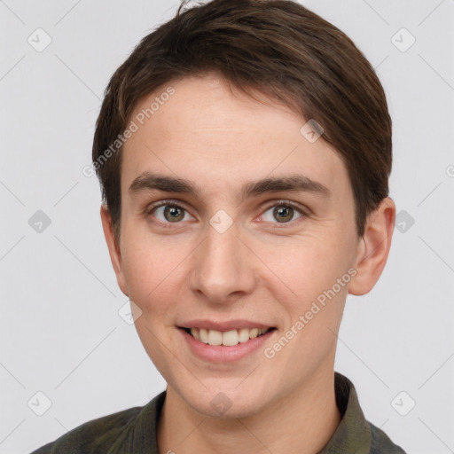 Joyful white young-adult female with short  brown hair and grey eyes