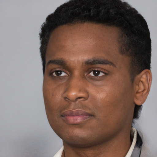 Neutral black young-adult male with short  black hair and brown eyes