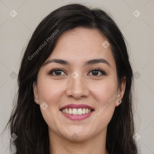 Joyful latino young-adult female with long  brown hair and brown eyes