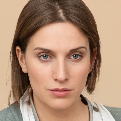 Neutral white young-adult female with medium  brown hair and grey eyes