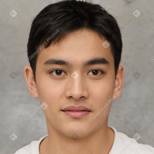 Joyful asian young-adult male with short  brown hair and brown eyes