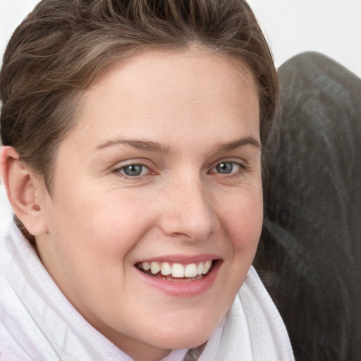 Joyful white young-adult female with long  brown hair and grey eyes