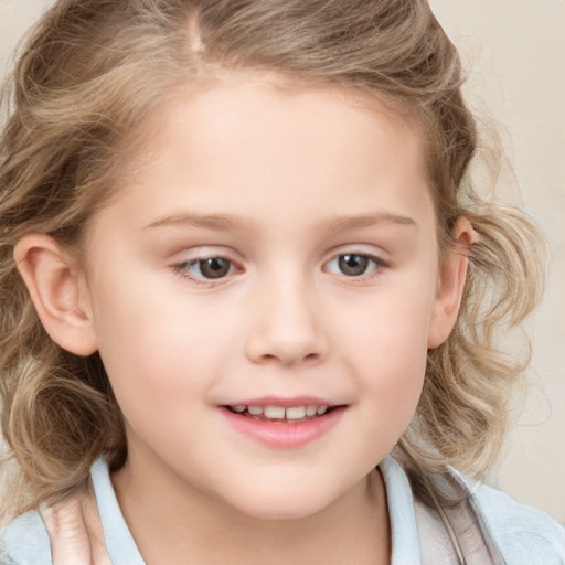 Joyful white child female with medium  brown hair and grey eyes