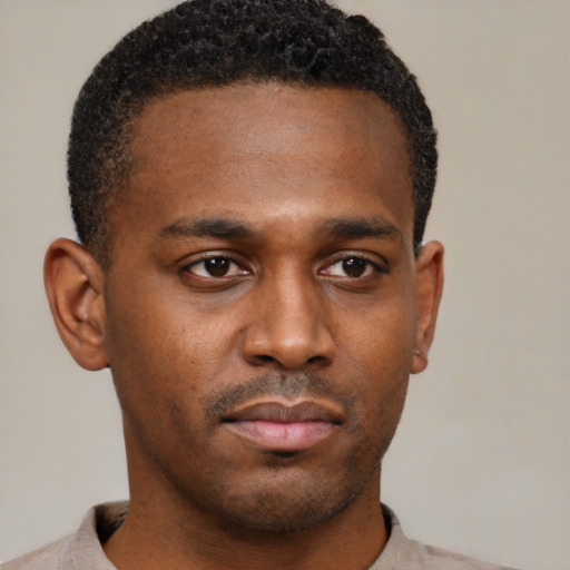 Neutral black young-adult male with short  brown hair and brown eyes