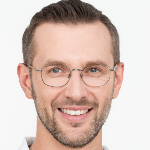 Joyful white adult male with short  brown hair and brown eyes