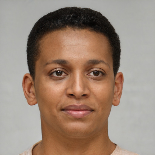 Joyful black young-adult female with short  brown hair and brown eyes