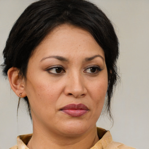 Joyful white adult female with medium  brown hair and brown eyes