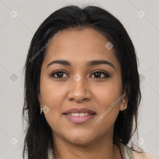 Joyful latino young-adult female with long  brown hair and brown eyes