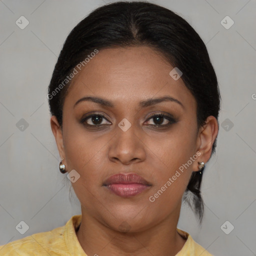 Joyful latino young-adult female with medium  brown hair and brown eyes