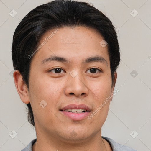 Joyful asian young-adult male with short  brown hair and brown eyes