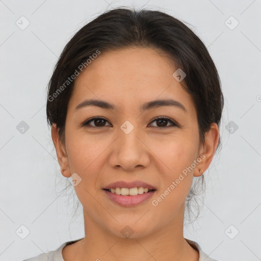 Joyful latino young-adult female with short  brown hair and brown eyes