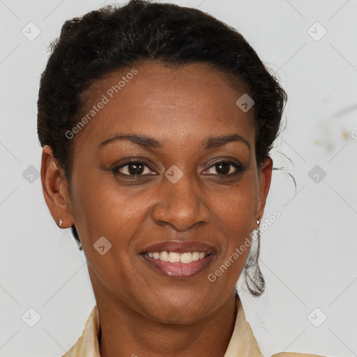 Joyful black adult female with short  brown hair and brown eyes