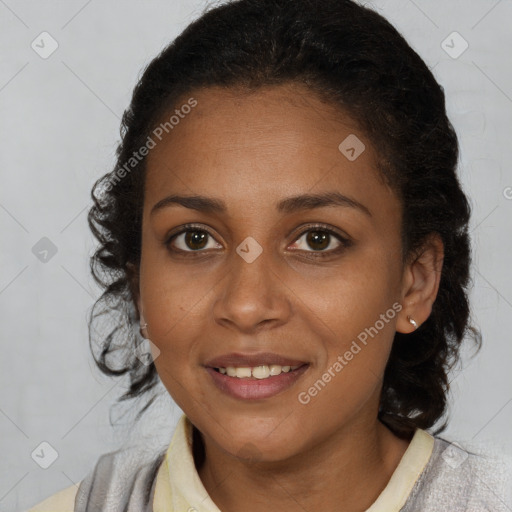 Joyful black young-adult female with short  brown hair and brown eyes