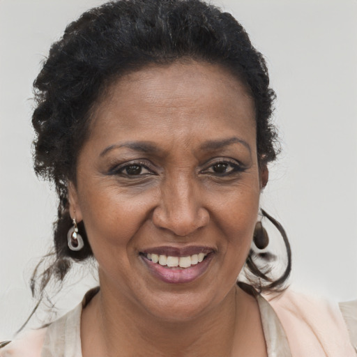 Joyful latino adult female with short  brown hair and brown eyes