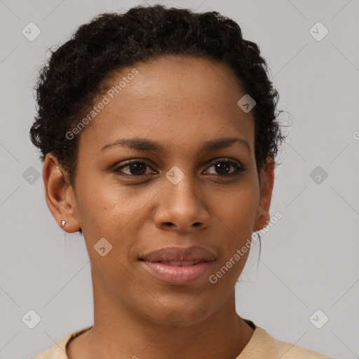 Joyful black young-adult female with short  brown hair and brown eyes