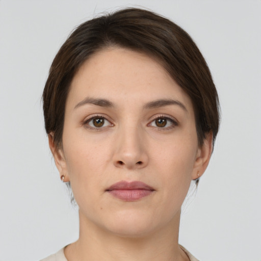 Neutral white young-adult female with short  brown hair and brown eyes