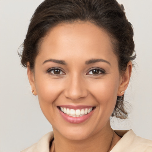 Joyful white young-adult female with medium  brown hair and brown eyes