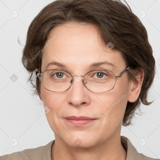 Joyful white adult female with medium  brown hair and grey eyes