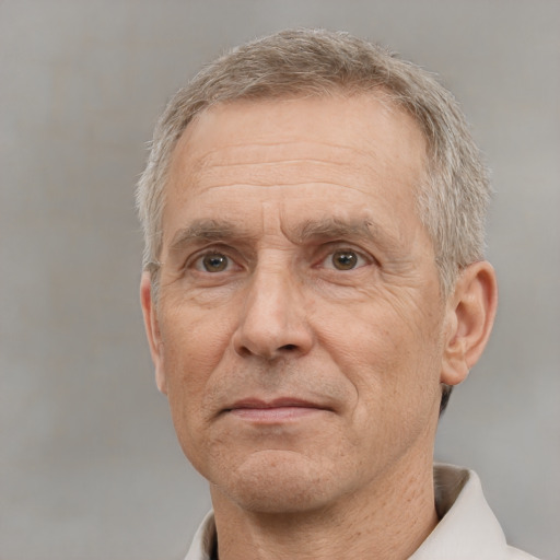 Neutral white middle-aged male with short  gray hair and brown eyes