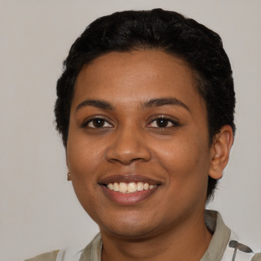 Joyful latino young-adult female with short  black hair and brown eyes